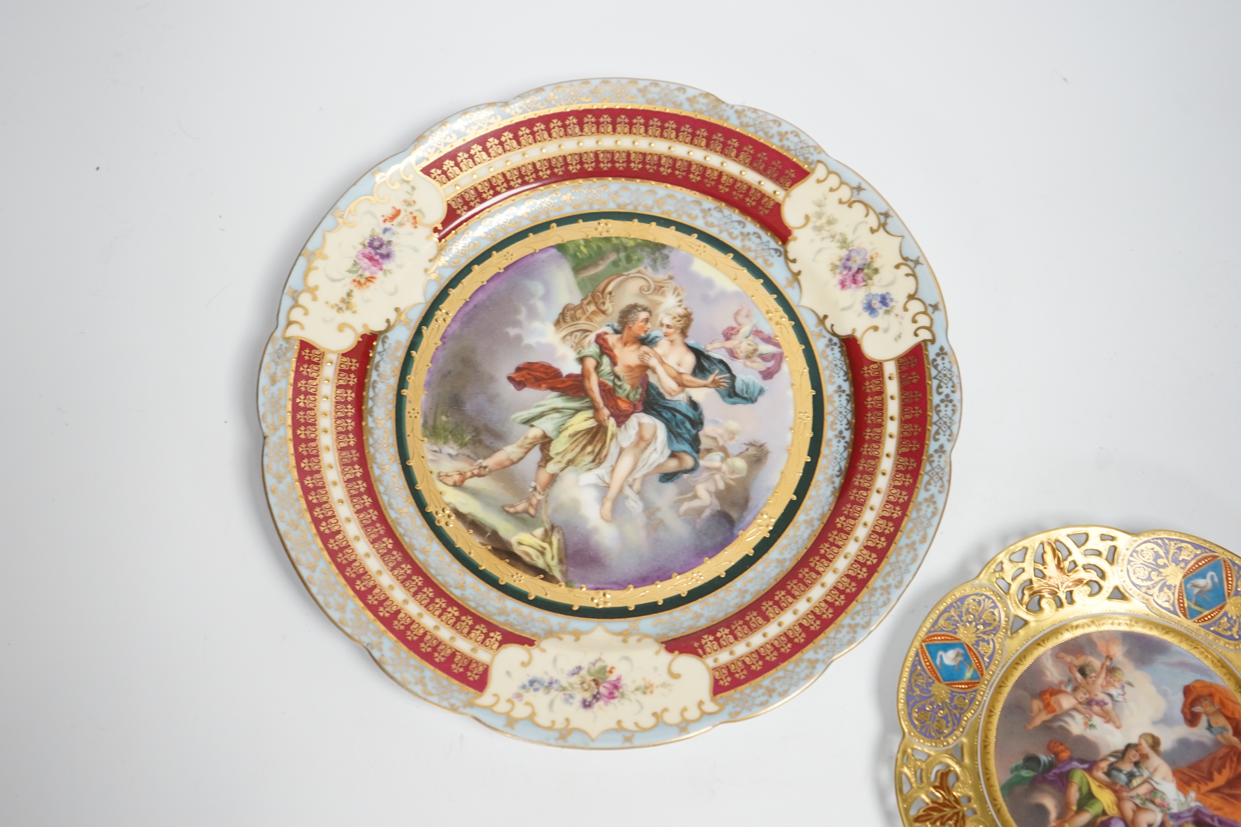 A late 19th century Vienna style “Mars and Venus “saucer and a Vienna style cabinet plate, largest 24cm diameter